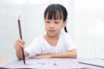 Kid practicing calligraphy writing