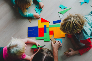 Children solving math puzzles together