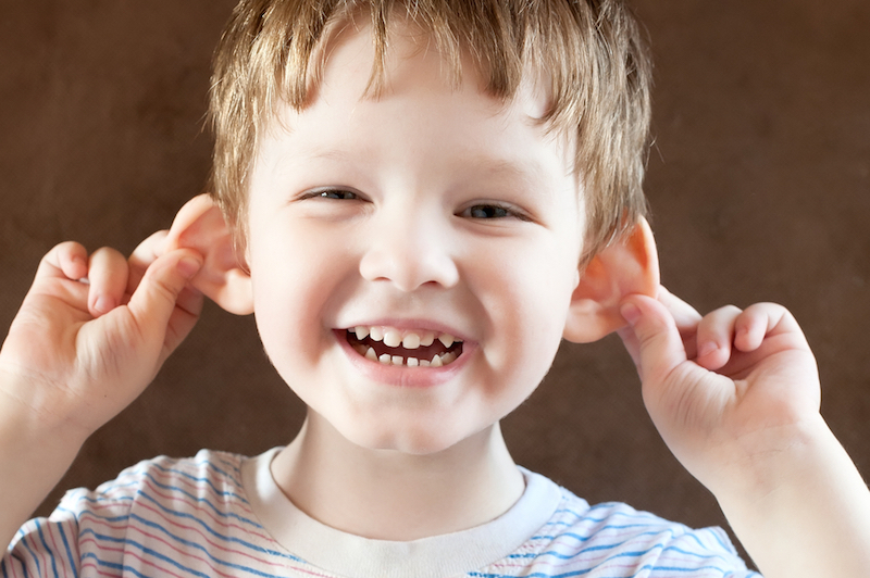 Kid showing his ears