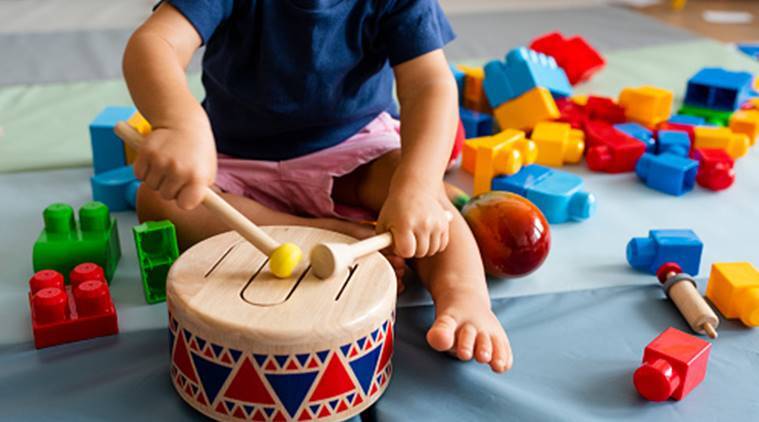 Kid playing with drums