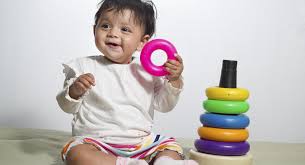toddler holding toys