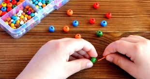 inserting thread inside the bead