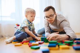 Father -son duo playing blocks