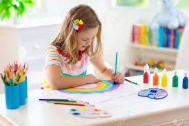 A girl painting a rainbow