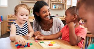 teacher happily teaching kids