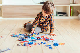 Child playing with jigsaw puzzles