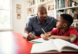 Father teaching math to kid