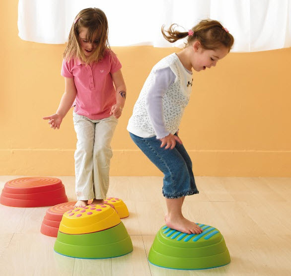 Two kids undergoing motor skills at kindergarden