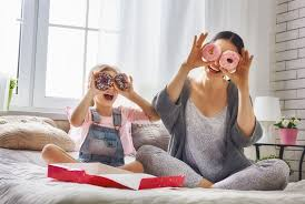 mother and child playing with doughnut