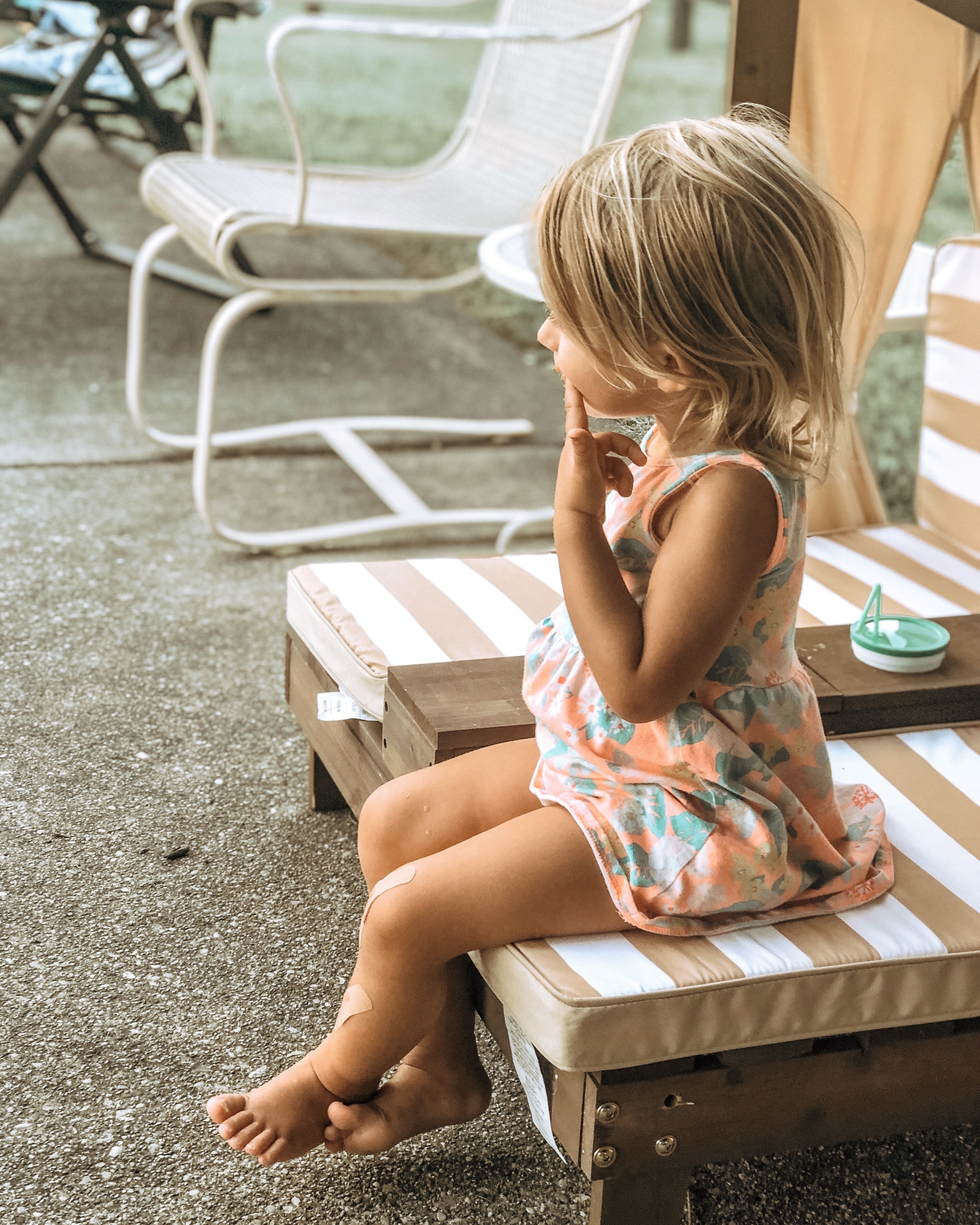 Photo of a kid sitting on chair