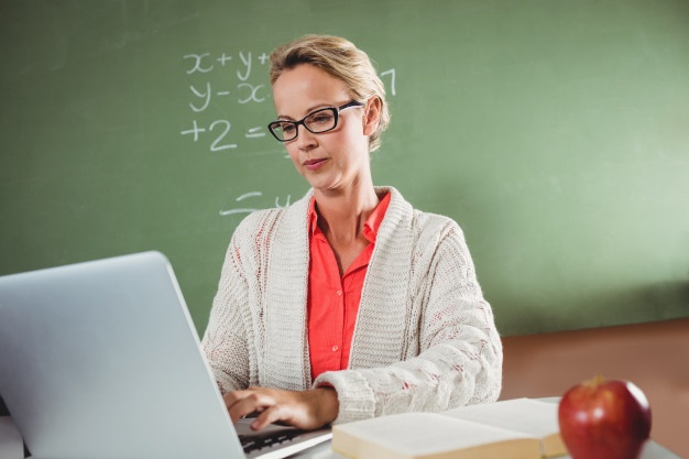 Teacher using a laptop
